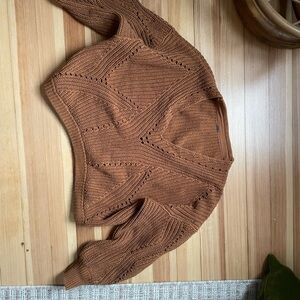 Free People Brown V-Neck Sweater with Intricate Knit Patterns